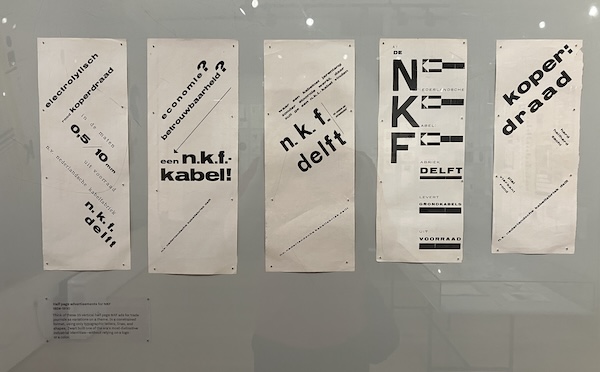 Five half-page advertisements for N. K. F. Delft. Lines of Dutch text run in contrasting fonts and angles. The pages have no graphics except for a few arrowheads.